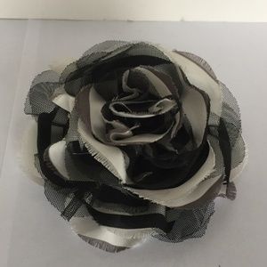 Black and white pin. 5" in diameter.